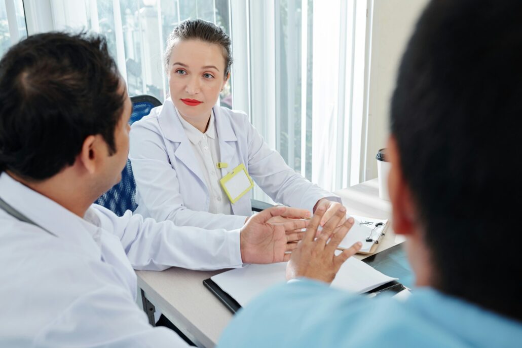 Chief doctor listening to her employees