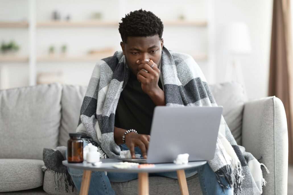 Sick black guy looking for symptomes on Internet