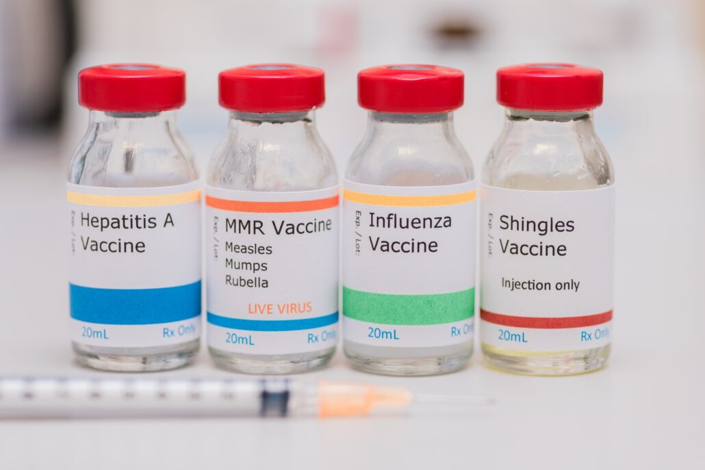 Mmr vaccine, influenza vaccine, shingles vaccine, hepatitis a, vaccination concept, syringe in front