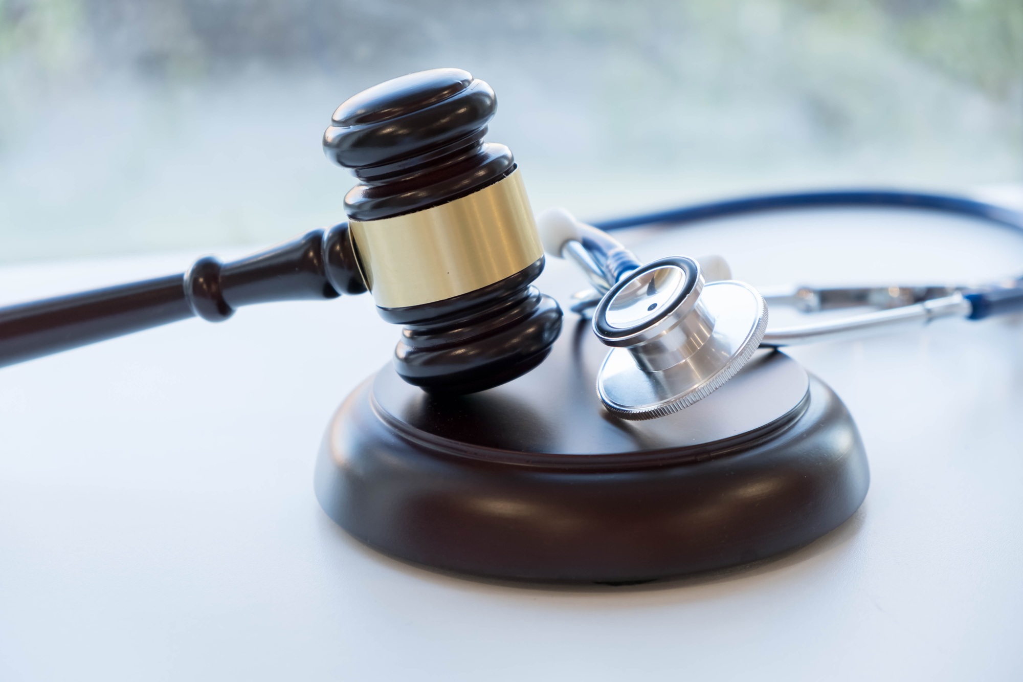 Gavel and stethoscope. medical jurisprudence. legal definition of medical malpractice.