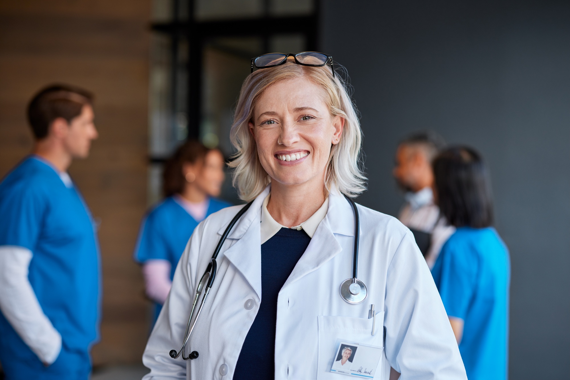 Smiling mature female physician in hospital